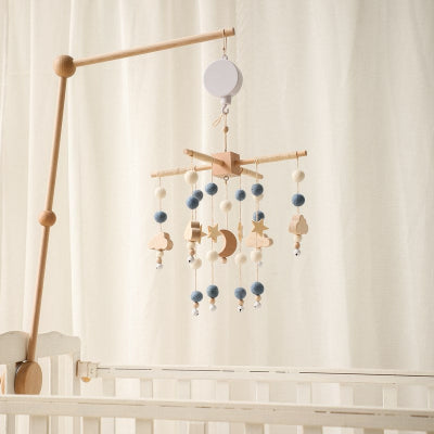 Mobile parfaitement en équilibre au berceau de bébé et illuminant sa chambre